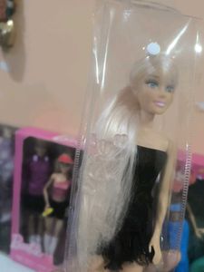 Hannah doll in black dress with long hair.