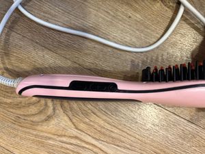 Woman’s hair straightener