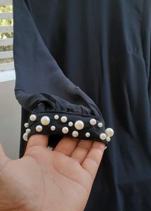 Elegant Black Dress with Pearl Detail