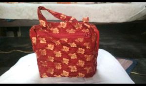 Haath Se Bana Lal Phoolon Wala Potli Bag - Eleganc