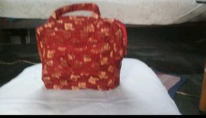 Haath Se Bana Lal Phoolon Wala Potli Bag - Eleganc