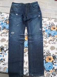Distressed Blue Denim Jeans