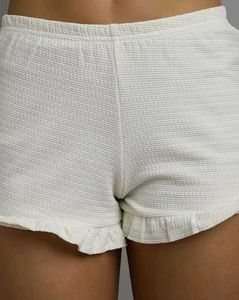 White Ruffle Hem Shorts