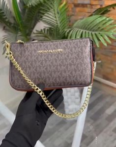 Michael Kors Clutch/ sling bags