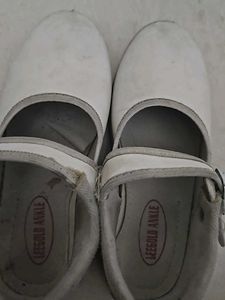Used white school shoes