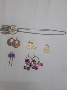 Multiple Pairs Of Earings And One Necklace