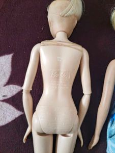 Two used barbie dolls