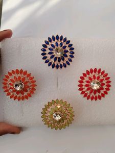 Red, Pista Green, Blue And Orange Four Colour Stone Rings Available.   99 Rs For 1 Piece.
