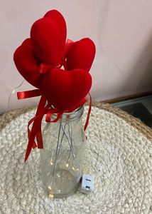 A Beautiful Glass Vase With 4 Heart  Stikes (17 C