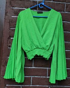Bright green crop top.