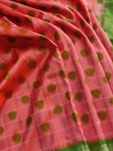 orange and green pocham.palli silk saree