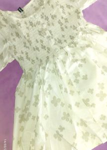 A Ruffled , Smoking Top With Good Sleeves