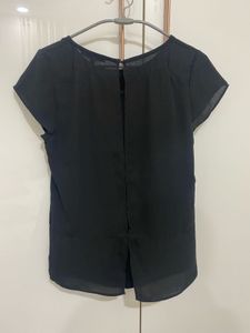 Chic Black Blouse with Embellished Detail