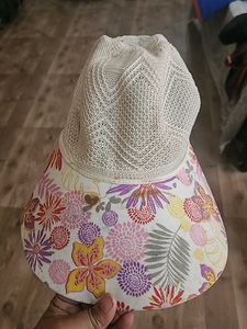 Sun Protection Cap And Black Ceramic Flower Vase