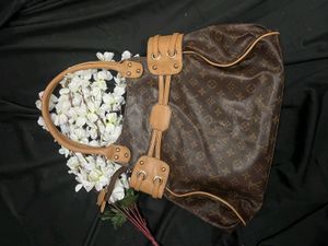 Louis Vuitton Logo Handbag with tassel