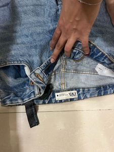 Ripped Knee Jeans