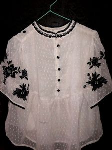 White Top With Wuater Half Sleeves, Can Be Pair With High Waist Jeans. It Can Be Use On Regular Bases