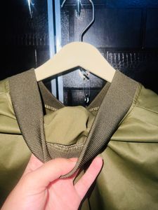 Olive Green jacket.