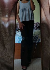 Sleeveless, loose-fit peplum top.