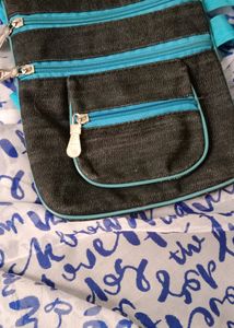 Sling Bags Of Combo Colours, 🟣 And 🔵 With 4 Big Compartments With 1 Small Compartment Also With Adjustable Straps Zips At Good Condition Material Is Soft And Flexible