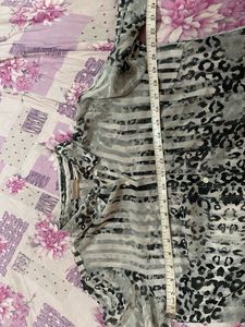 A Mesh Top Shirt Which Is In Greyish Colour
