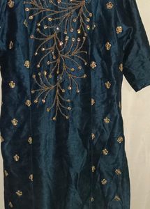 Its a Blue Dress.. With Beads Work On It.