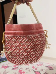 Regal Pink Pearl Potli Bag with Embellished Handle