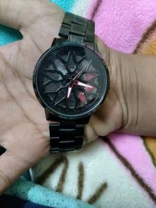 Red colour full wheel rotating analog watch