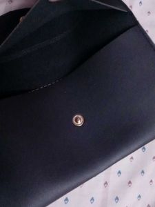 black clutch and guess watch