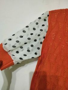 Orange Top with Polka Dot Sleeves