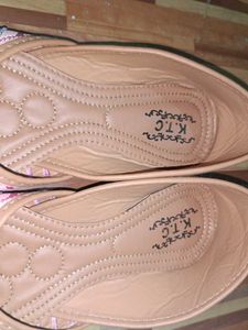 pair of traditional pink embroidered juttis