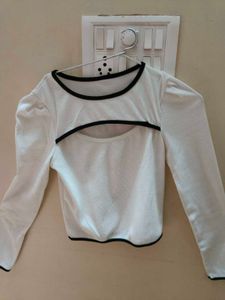 A white cut-out long sleeve crop top