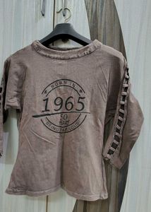 A Brown Top With Sleeves Detailing