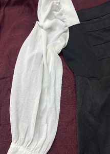 Chic black dress with white sleeves