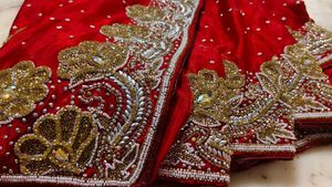 Red. heavy Embroidered. expansive 💯 saree