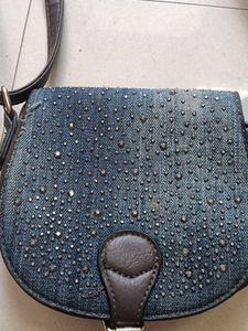 blue and dark brown sling bag