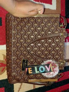 Brown Quilted Handbag with Sequins and Pom-Pom Cha