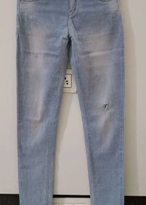 Light Wash Distressed Skinny Jeans