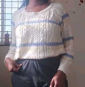 a blue white woolen sweatshirt