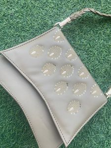 Elegant Clutch with Peacock Detail