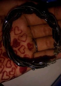 black breslet and a multi colour bangle