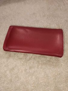 it's new Burgundy Clutch with Gold Detail