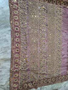 Heavy Work Purple Net Saree With Shiny Petticoat.