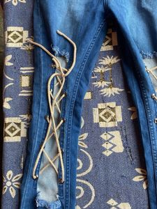 Distressed Lace-Up Jeans