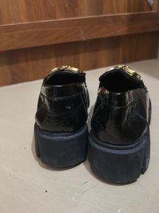 Black Loafers with Gold Detail