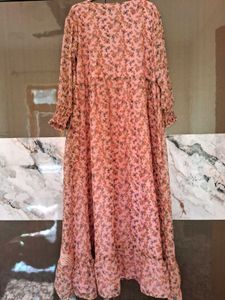 A pink floral gown with white lace trim