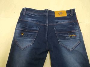 Blue Jeans With Two Red Stripes On Sides