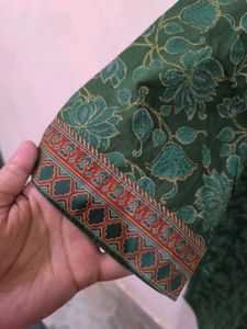 Green floral print kurti with golden detailing