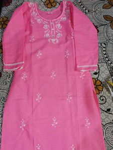 Traditional pink kurti with white embroidery.