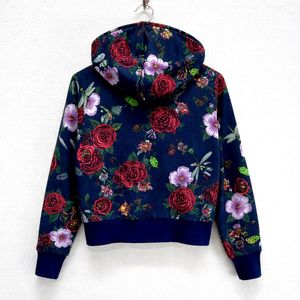 This is an Adidas x Rita Ora navy floral pullover